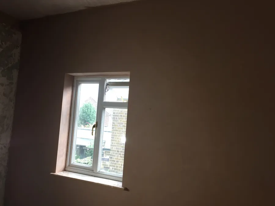 Freshly plastered room with a new window